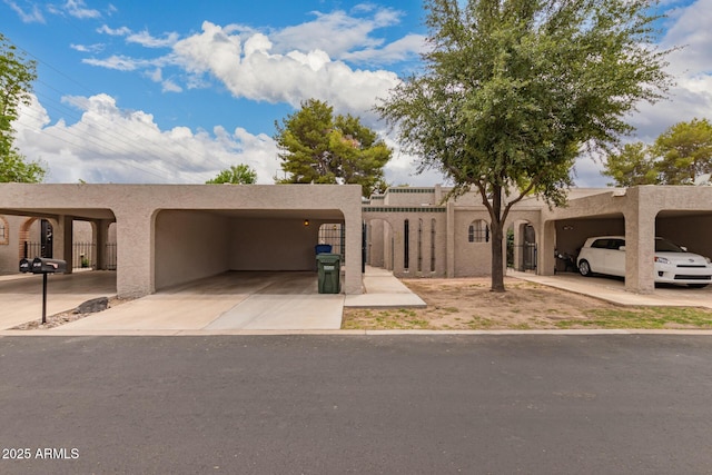 1173 E Cochise Dr, Phoenix, AZ 85020 - pueblo revival-style home featuring stucco siding and driveway