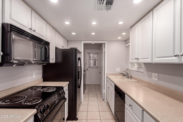 1173 E Cochise Dr, Phoenix, AZ 85020 - kitchen featuring black appliances, a sink, white cabinets, recessed lighting, and light countertops