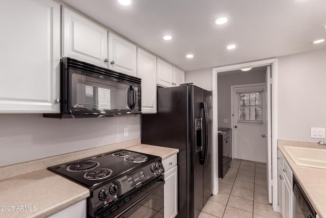 1173 E Cochise Dr, Phoenix, AZ 85020 - kitchen featuring black appliances, a sink, white cabinetry, recessed lighting, and washer and clothes dryer