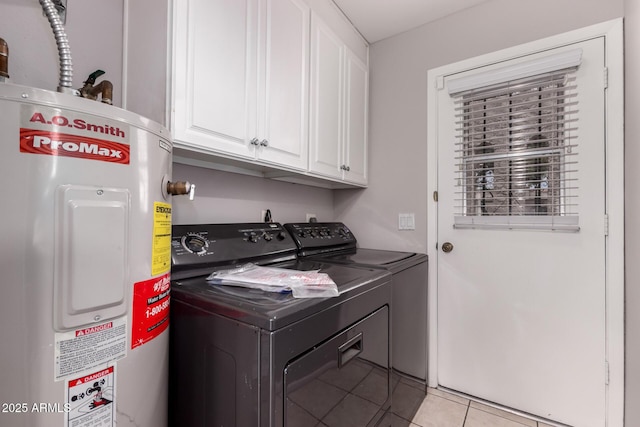 1173 E Cochise Dr, Phoenix, AZ 85020 - laundry area with water heater, cabinet space, washing machine and dryer, and light tile patterned floors