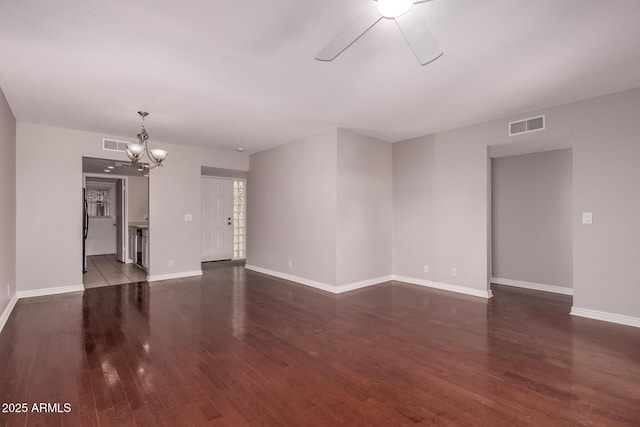 1173 E Cochise Dr, Phoenix, AZ 85020 - unfurnished living room featuring a ceiling fan, dark wood finished floors, a chandelier, and baseboards