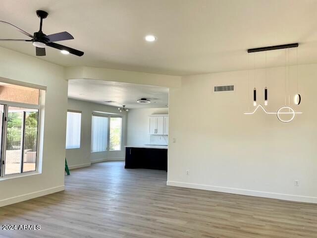 spare room featuring hardwood / wood-style floors and ceiling fan