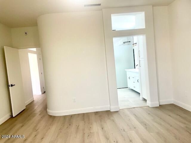 unfurnished room featuring light hardwood / wood-style floors