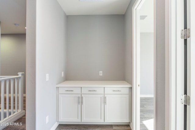 hallway with dark wood-type flooring