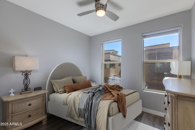 bedroom featuring ceiling fan and dark hardwood / wood-style flooring