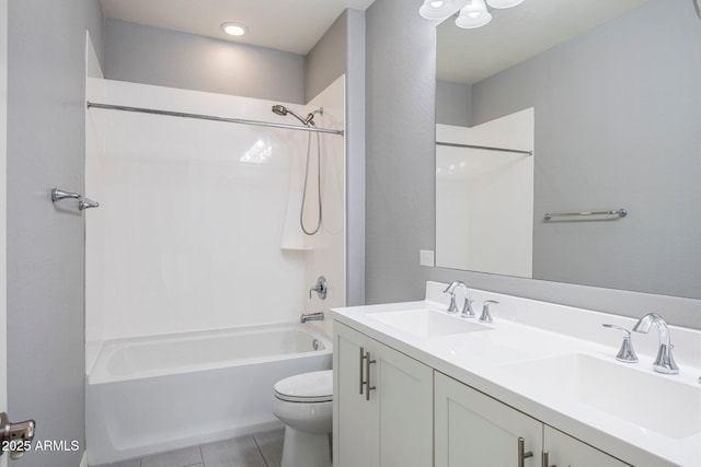 full bathroom featuring shower / bathing tub combination, vanity, tile patterned flooring, and toilet