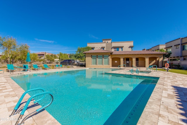 view of swimming pool with a patio area