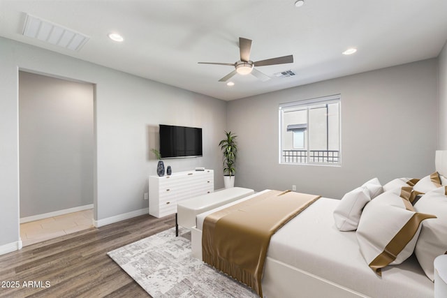 bedroom with dark wood-type flooring and ceiling fan