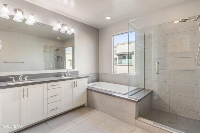 bathroom featuring vanity, separate shower and tub, and tile patterned floors