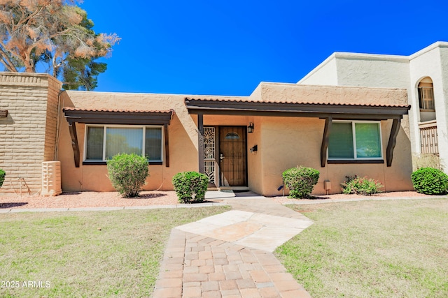1726 W Claremont St, Phoenix, AZ 85015 - adobe home with stucco siding and a front lawn