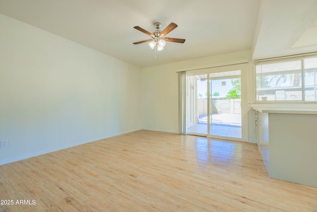 1726 W Claremont St, Phoenix, AZ 85015 - empty room with ceiling fan, light wood-style flooring, and baseboards