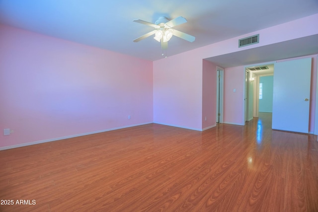 1726 W Claremont St, Phoenix, AZ 85015 - empty room featuring a ceiling fan, light wood-style floors, and baseboards