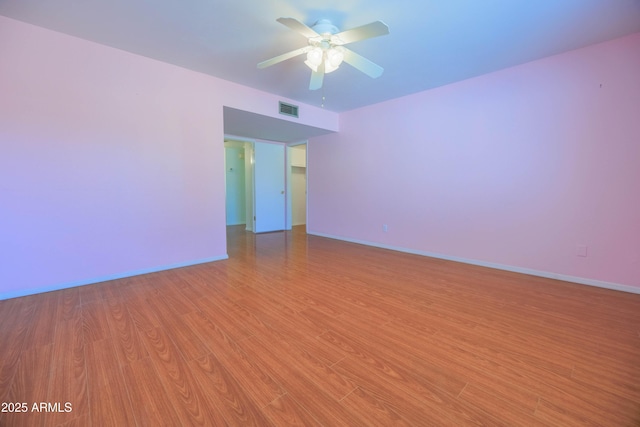 1726 W Claremont St, Phoenix, AZ 85015 - spare room featuring a ceiling fan, light wood-type flooring, and baseboards