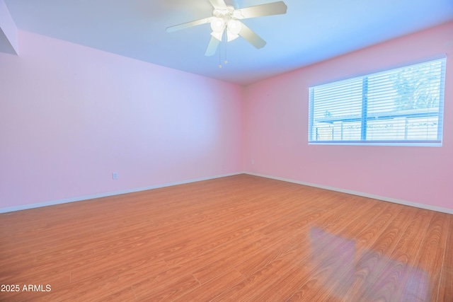 1726 W Claremont St, Phoenix, AZ 85015 - unfurnished room featuring light wood-type flooring, baseboards, and a ceiling fan