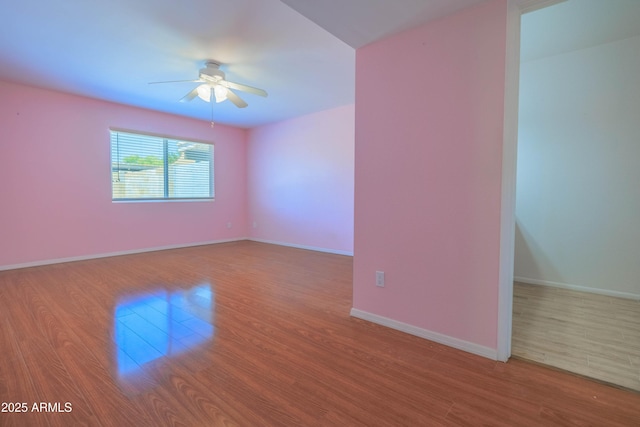 1726 W Claremont St, Phoenix, AZ 85015 - unfurnished room with a ceiling fan, wood finished floors, and baseboards