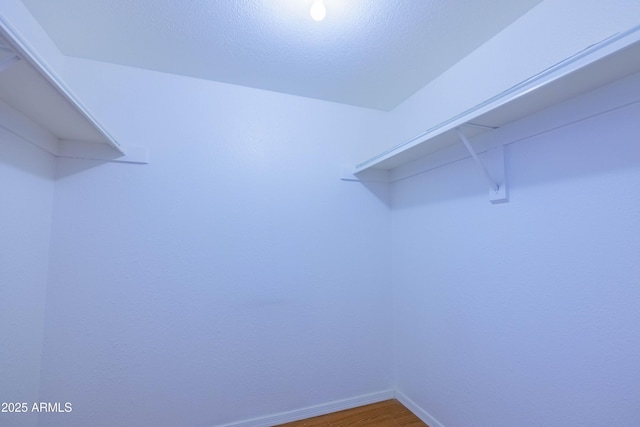 1726 W Claremont St, Phoenix, AZ 85015 - walk in closet featuring wood finished floors