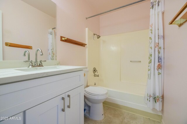 1726 W Claremont St, Phoenix, AZ 85015 - bathroom featuring tile patterned flooring, toilet, vanity, and shower / bath combo with shower curtain