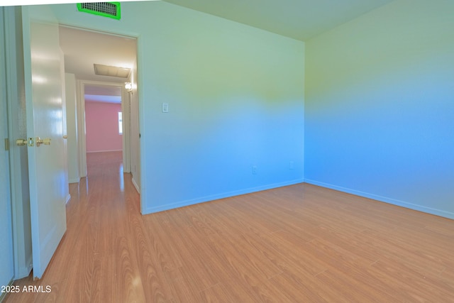 1726 W Claremont St, Phoenix, AZ 85015 - empty room with light wood-style flooring and baseboards