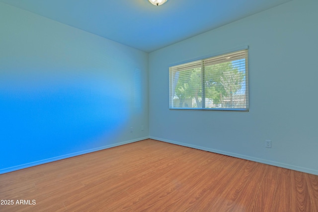 1726 W Claremont St, Phoenix, AZ 85015 - empty room with wood finished floors and baseboards