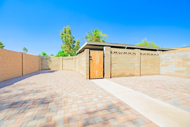 1726 W Claremont St, Phoenix, AZ 85015 - view of patio featuring a fenced backyard and a gate