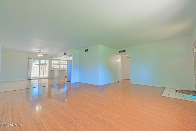 1726 W Claremont St, Phoenix, AZ 85015 - unfurnished room with a ceiling fan, wood finished floors, and baseboards