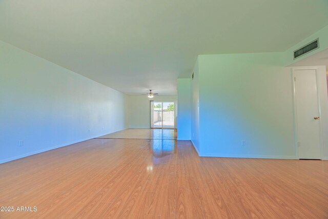 1726 W Claremont St, Phoenix, AZ 85015 - empty room featuring light wood-style floors and baseboards