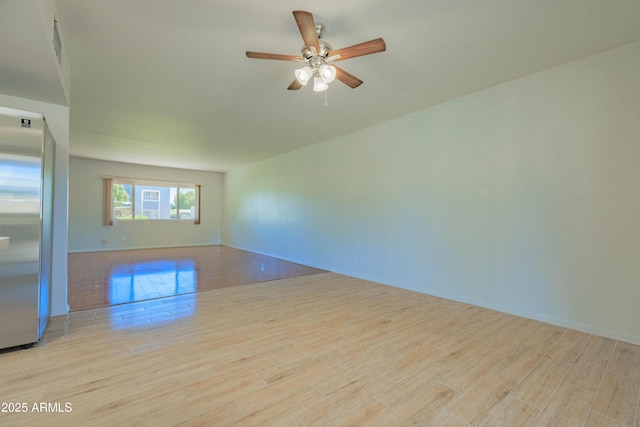 1726 W Claremont St, Phoenix, AZ 85015 - unfurnished room with wood finished floors, ceiling fan, and baseboards