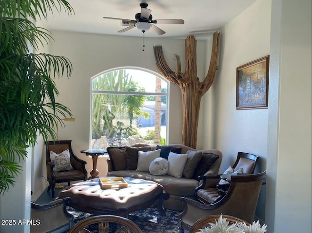 living area featuring ceiling fan