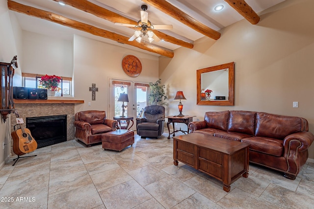 living room featuring beam ceiling, french doors, and ceiling fan