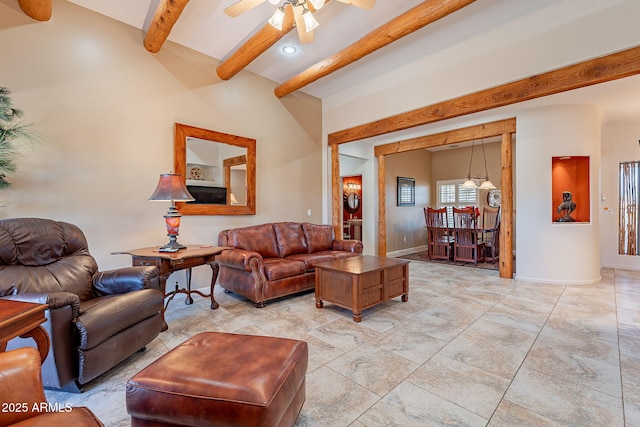 living room with ceiling fan and beamed ceiling