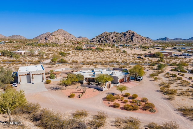 birds eye view of property with a mountain view