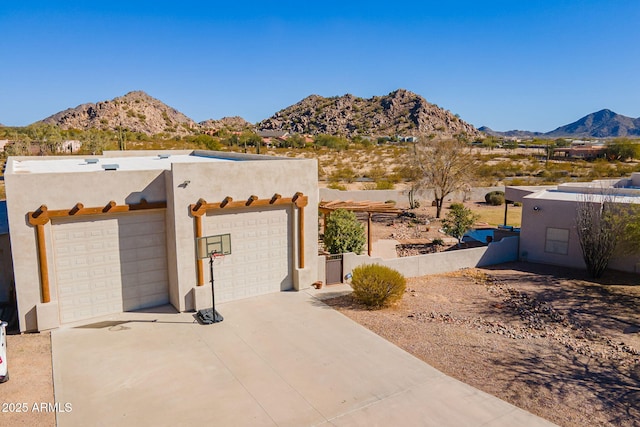 view of front of home featuring a garage and a mountain view