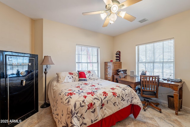 tiled bedroom with ceiling fan