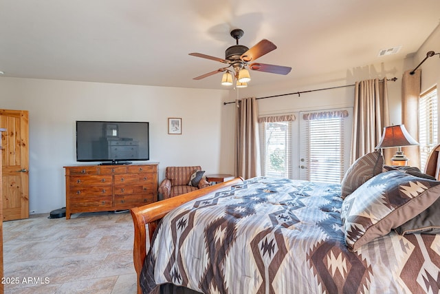 bedroom featuring ceiling fan and multiple windows