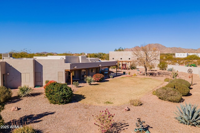 rear view of property with a mountain view