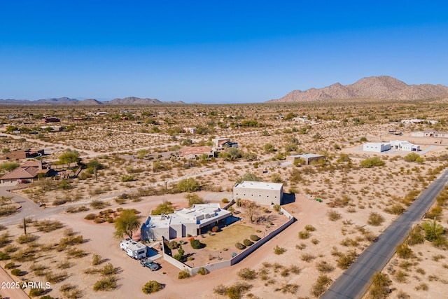 birds eye view of property with a mountain view