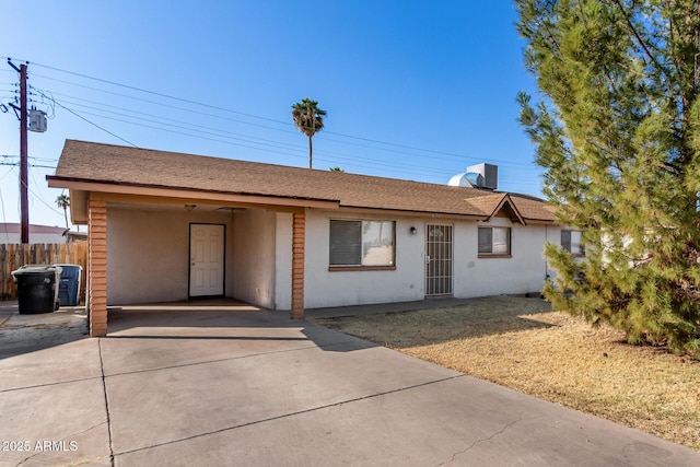 ranch-style home featuring a carport