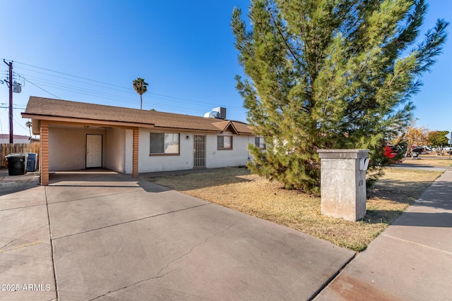 view of front of home with a carport