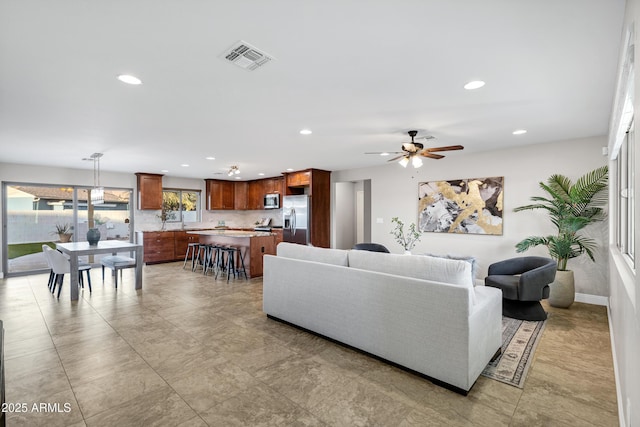 living room featuring ceiling fan