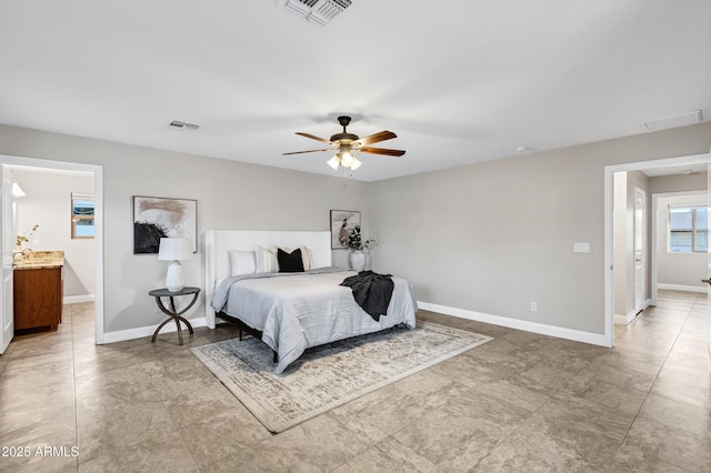 bedroom featuring ensuite bath and ceiling fan