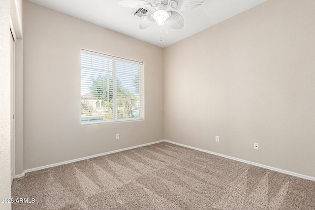 unfurnished room featuring ceiling fan, visible vents, baseboards, and carpet flooring