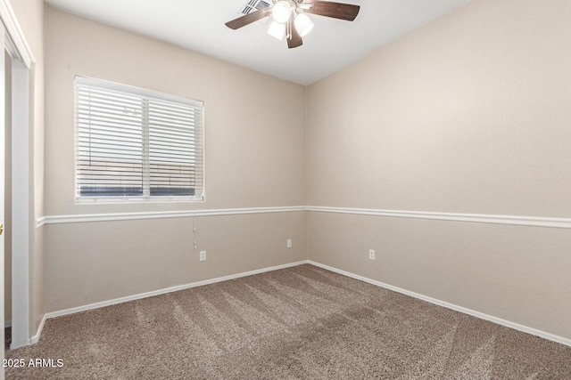 empty room with carpet, baseboards, and a ceiling fan