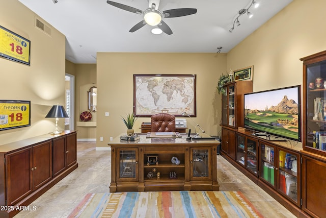 office with a ceiling fan and light tile patterned floors