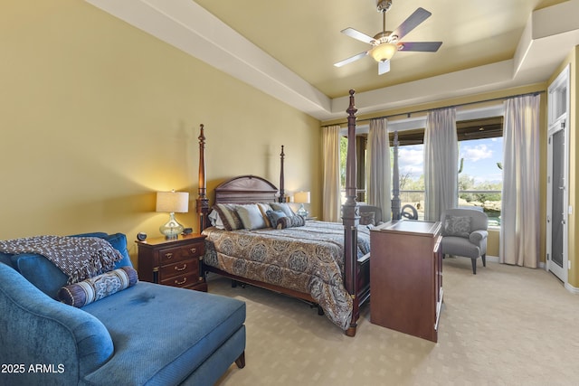 bedroom with light carpet, multiple windows, baseboards, and ceiling fan