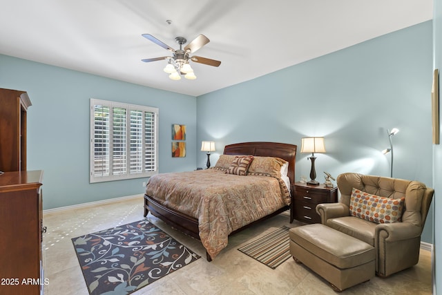 bedroom featuring baseboards and ceiling fan