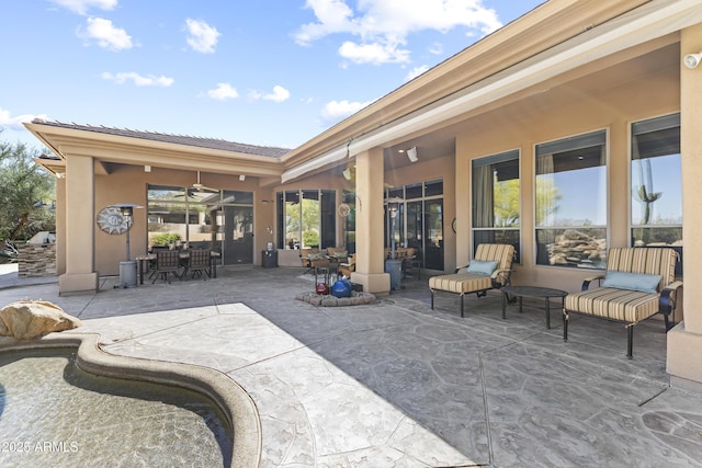 view of patio / terrace with a ceiling fan and outdoor dining area