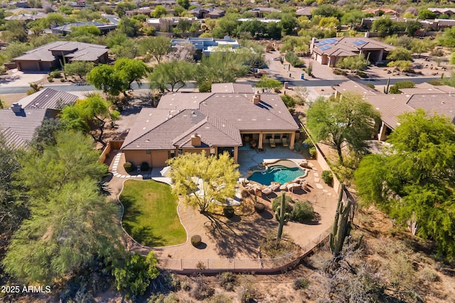 aerial view of residential area featuring a pool