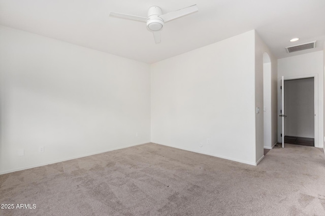 empty room with light carpet and ceiling fan