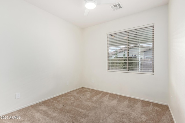 unfurnished room with light carpet and ceiling fan