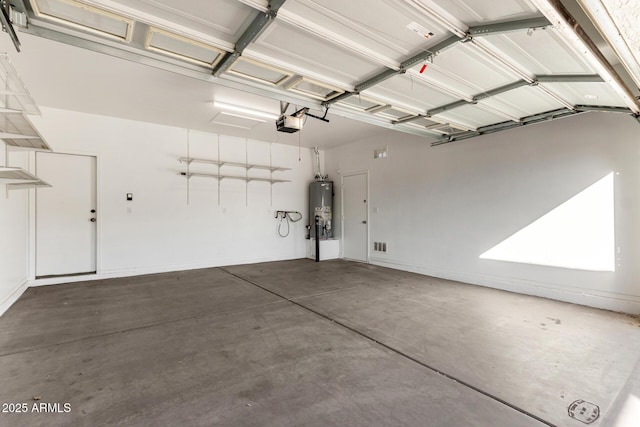 garage featuring a garage door opener and water heater